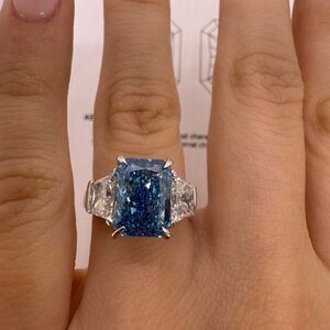 4.09 carat fancy vivid blue radiant lab grown diamond trapezoid engagement ring